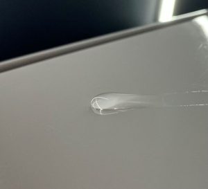 "Hydrophobic water-beading effect on a polished car surface, highlighting the benefits of Gold Coast car polishing."