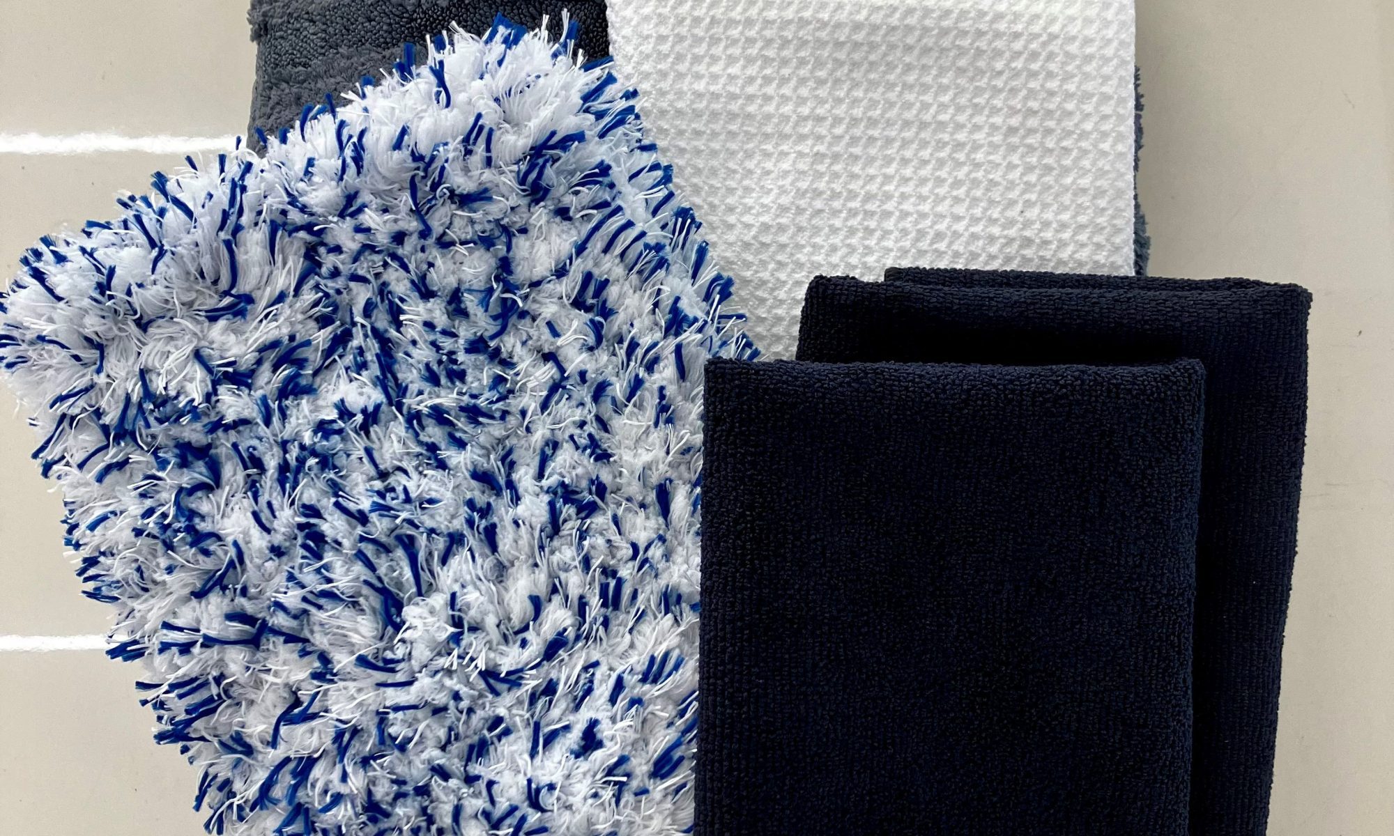 "Premium microfiber drying towel, window cloths, and wash mitts for car care and ceramic coating maintenance"